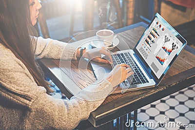 Graphics and diagrams on computer screen. Woman analyzing data. Student learning online. Freelancer working home Stock Photo