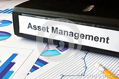 Graphs and file folder with label Asset Management. Stock Photo