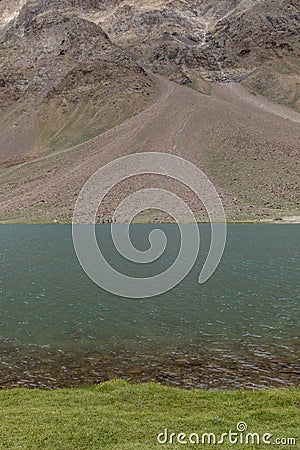 Gras water and mountains near chandrataal lake in Spiti Valley Stock Photo