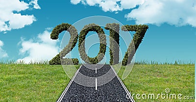 2017 in grass against a composite image 3D of asphalt road in the sky Stock Photo