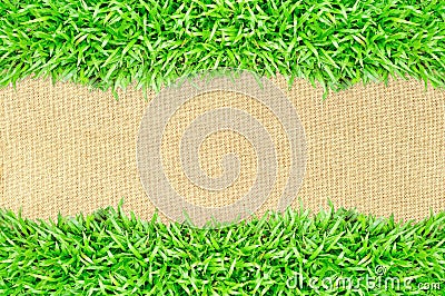 Grass frame on burlap texture background Stock Photo