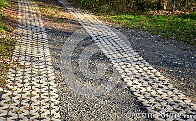 Grass paving enables the strengthening of surfaces and at the same time their grassing. The joints can also be filled with gravel, Stock Photo