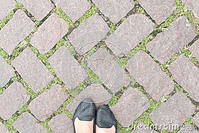 Grass Stone Floor texture pavement design and woman's feet. Stock Photo