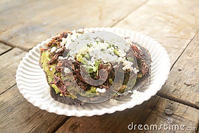 Grasshopper mexican taco, edible insect tortilla toast made with blue corn and filled with guacamole, cheese and coriander from Me Stock Photo