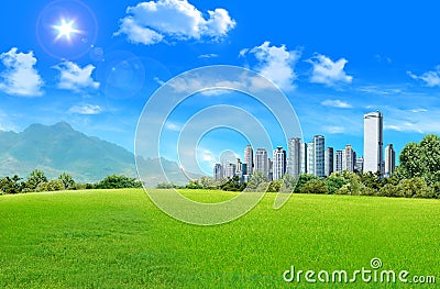 Grassland with city Stock Photo