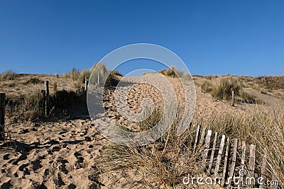 Grassy sand dune of Ty Hoche beach in Plouharnel Stock Photo