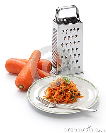 Grated carrot salad and grater Stock Photo