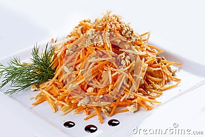 Grated carrots with walnuts. Stock Photo