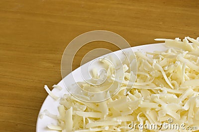 Grated cheddar cheese Stock Photo