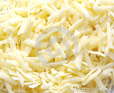 Grated cheddar cheese background Stock Photo