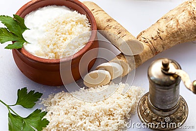 Grated horseradish with pepper mill Stock Photo