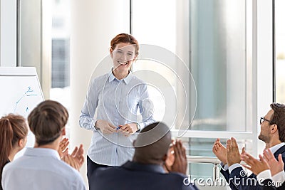 Grateful business audience applauding speaker coach thanking for conference Stock Photo
