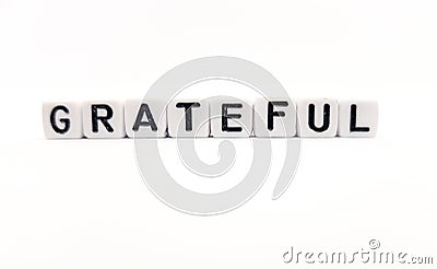 grateful word built with white cubes and black letters on white background Stock Photo