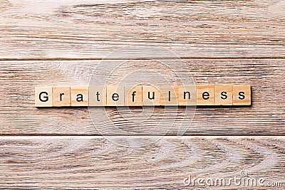 Gratefulness word written on wood block. gratefulness text on wooden table for your desing, concept Stock Photo