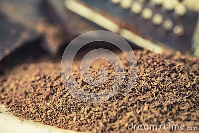 Grater and grated chocolate closeup Stock Photo