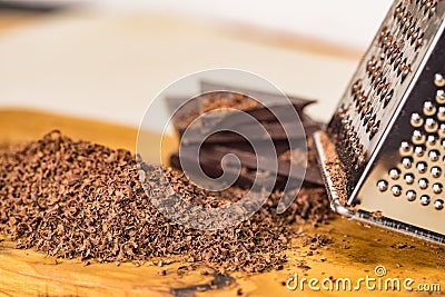 Grater and grated chocolate closeup Stock Photo