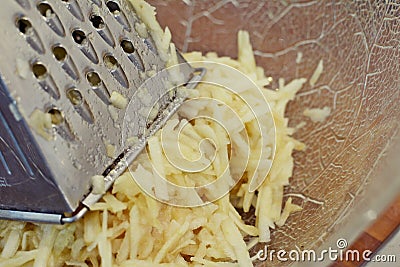 Grating apples for strudel or burek Stock Photo