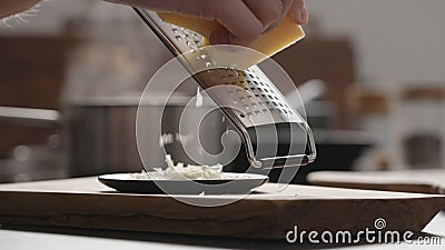 gratring vintage cheese on black saucer Stock Photo