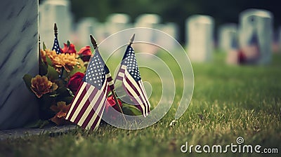 A grave with an american flag and colorful flowers are noticeable in the background for memorial day Stock Photo