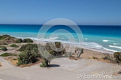 Gravel beach at Kiotari on Rhodes island, Greece with water in different colours Stock Photo