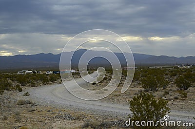 Monsoon rain clouds over mountain range edge of dry Mojave Desert valley Nevada, USA Editorial Stock Photo