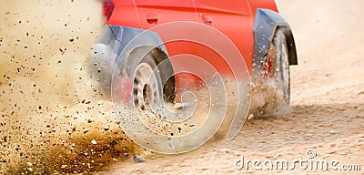 Gravel splashing from rally race car drift on track Stock Photo