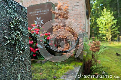 Gravestone and chain at old beautiful semetery in Finland Stock Photo