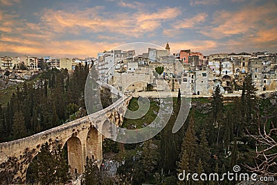 Gravina in Puglia, Bari, Italy: landscape at sunrise of the old town and the ancient aqueduct bridge Stock Photo