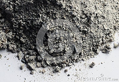 Gray ashes remaining on a white background Stock Photo