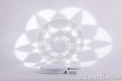 Gray background with a white heart shape behind for product commercial light shape Stock Photo