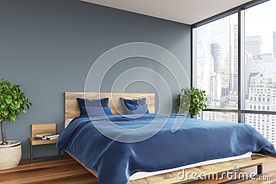 Gray bedroom, blue bed Stock Photo