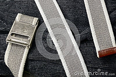 The gray belt is wound on black velveteen trousers Stock Photo