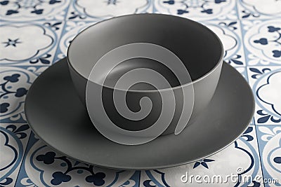 Gray Bowl in a tiles background Stock Photo