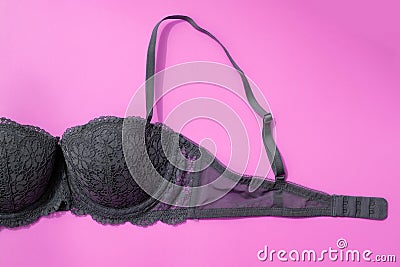 Gray bra on a pink background top view. Stock Photo
