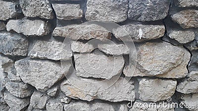 Gray-brown wall of stones Stock Photo