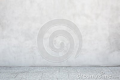 Gray cement wall with empty stone tiled floor Stock Photo