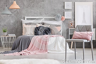 Gray chair with pink pillow Stock Photo