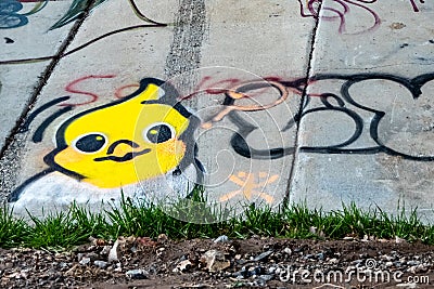 Graffiti wall with little yellow bird drawing Editorial Stock Photo