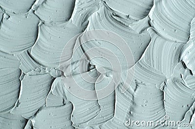 Gray cosmetic clay facial bentonite mask, cream, scrub, body wrap texture close up. Abstract background, brush strokes Stock Photo