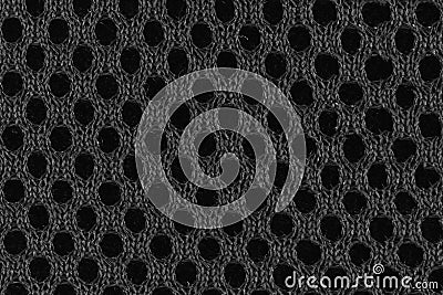 Gray fiber with black holes seen from close up Stock Photo