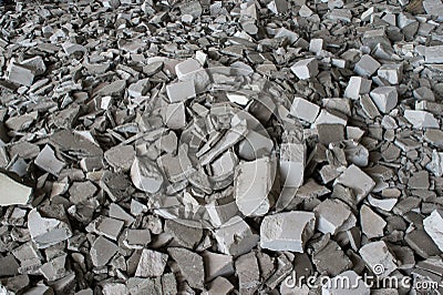 Gray fragments of silicate bricks with the remains of the solution after the demolition of the building wall. Background Stock Photo