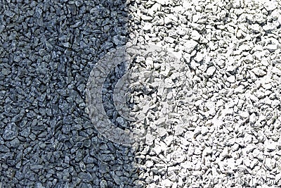 Gray granite pebble texture divided by shadow. Stock Photo