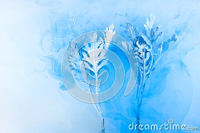 Flower water blue background white inside under paints acrylic smoke streaks grass sea haze blur underwater world planet Stock Photo