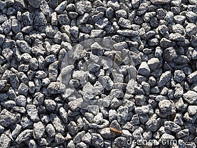 Gray gravel background - small stones. Stone aggregate. Stock Photo