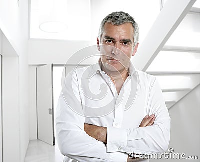 Gray hair businessman interior white office Stock Photo