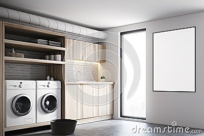 Gray laundry room interior, white washing machines Stock Photo