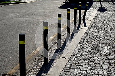 Gray metal bollards are used to protect pedestrians in the pedestrian Stock Photo