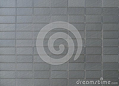 Gray natural stone tiles for modern ventilated building facade or walls Stock Photo