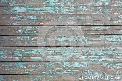 Gray old fence wall of wooden planks with blue turquoise peeling paint and cracks. horizontal lines. rough surface texture Stock Photo