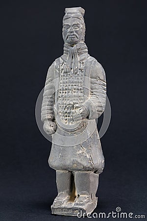 Gray oriental man statuette over black background Stock Photo